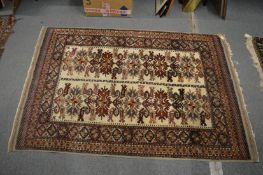 Persian rug with geometric decoration, 178cm x 119cm.