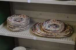 A quantity of Imari colour ironstone dinnerware.