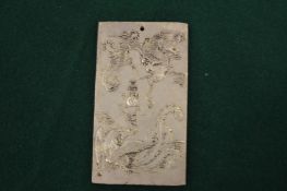 A Chinese silver zodiac amulet.