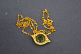 Decorative eye shaped pendant and chain.