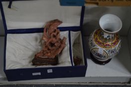 Chinese carved soapstone figure group and a porcelain vase.