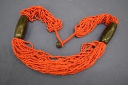 A coral style necklace.