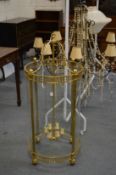 A large and impressive brass and glass circular hall lantern, 120cm high x 55cm diameter.