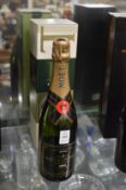 A bottle and Moet and Chandon 1999 vintage Champagne, boxed.