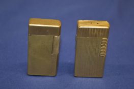 Two Dunhill lighters.
