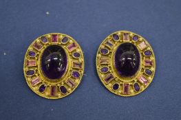 A pair of decorative ear clips.