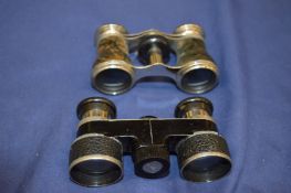 Two pairs of opera glasses.