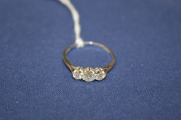 An 18ct white gold platinum three stone diamond ring.