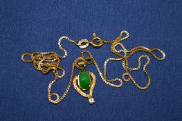 An 18ct gold chain with yellow metal pendant.