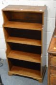 A pair of small mahogany waterfall style bookcases.