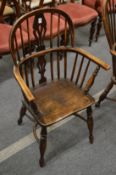 A 19th century ash and elm Windsor armchair.