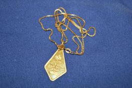 An 18ct gold chain with a fine gold pendant.