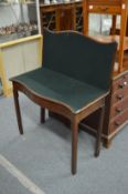 A George III mahogany serpentine fronted fold-over card table.