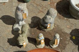 Five composite garden ornaments modelled as animals and birds.