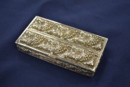 An embossed white metal box.