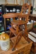 An old metamorphic childs high chair.