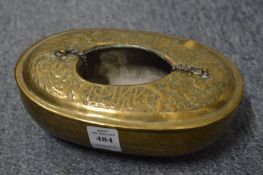 An Islamic embossed and engraved brass kashkool.