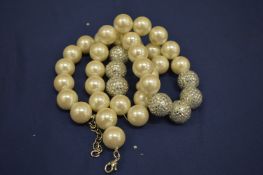 A diamante and pearl style necklace.