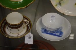 A 19th century coffee can and saucer together with a blue and white tea bowl and saucer.
