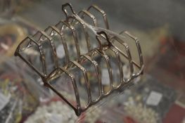 A pair of silver toast racks.