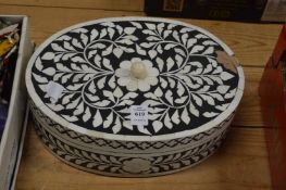 An ebonised and bone inlaid box and cover.