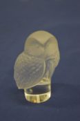 A Lalique frosted glass owl.