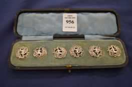 A cased set of six Art Nouveau silver buttons.