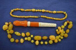 Quantity of amber or amber style jewellery.