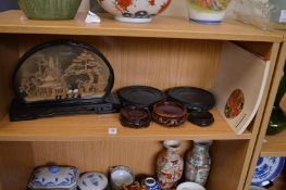 A Chinese cork picture, various stands and a book.