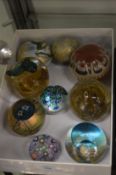 A collection of glass paperweights.