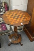 A 19th century rosewood games table.