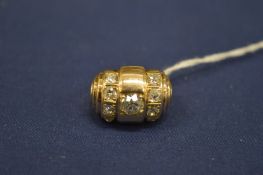 An unusual 14ct gold and diamond barrel shaped ring.