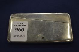 A plain sterling silver card case.