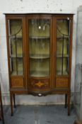 An Edwardian inlaid mahogany display cabinet.