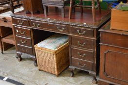 A mahogany pedestal desk.
