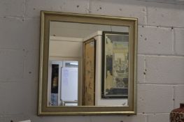 A modern square shaped mirror.