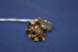 An 18ct gold flower head cluster ring.