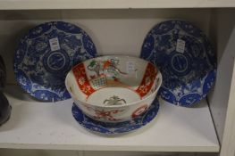 A set of three Japanese blue and white plates and an Imari style bowl.
