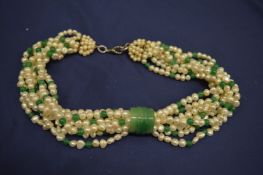 A long jadeite and pearl necklace.