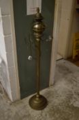 A brass floor standing lamp.