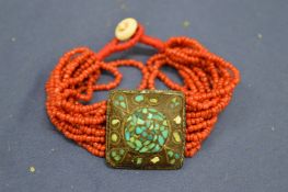 Decorative turquoise and coral type bracelet.