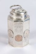 A CONTINENTAL WHITE METAL OCTAGONAL SHAPE TEA CANISTER, with threaded cover and hinged ring