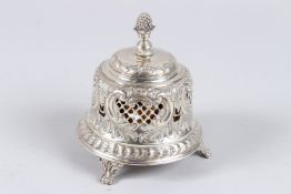 A LATE VICTORIAN SILVER TABLE BELL, with pineapple finial, pierced and chased body on three claw