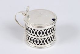 A SILVER DRUM MUSTARD POT, with pierced sides and blue glass liner, London 1962, maker CJV, 2.5in