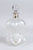AN ASPREY GLASS DECANTER AND STOPPER with silver rim. London 1932