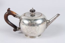 A GEORGE II SILVER BULLET SHAPE TEAPOT, engraved with a hereldic crest, London 1731, maker WD.
