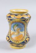 A SMALL ITALIAN MAIOLICA DRUG JAR, of waisted form, painted panel depicting the bust of a Centurion,