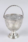 A GEORGE III SILVER PEDESTAL SUGAR BASKET, with swing handle, pierced and engraved decoration with