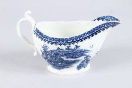 A CAUGHLEY BLUE AND WHITE SAUCEBOAT, CIRCA 1790 - 1792. Fishermen or Pleasure Boat pattern. 7ins