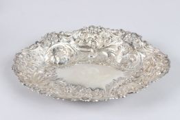 A SILVER OVAL DISH, embossed with flowers and leaves, Sheffield 1922, maker W M & S, 10.5in long.